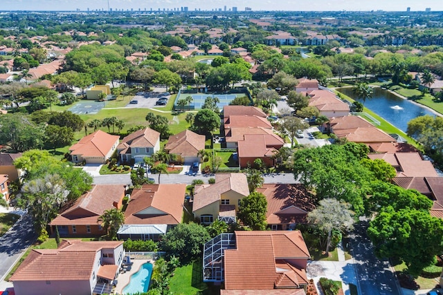 bird's eye view featuring a water view and a residential view