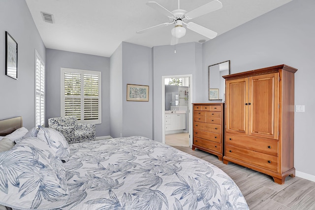 bedroom featuring light wood-style floors, baseboards, multiple windows, and visible vents