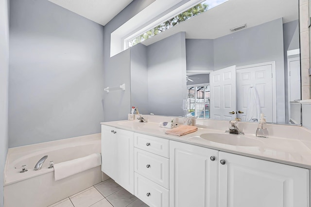 full bath featuring double vanity, tile patterned flooring, a sink, and visible vents