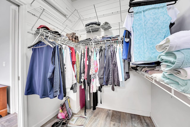 spacious closet with wood finished floors