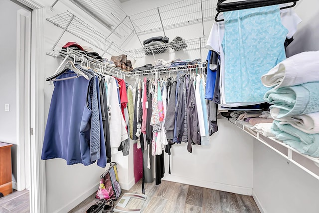 spacious closet featuring wood finished floors