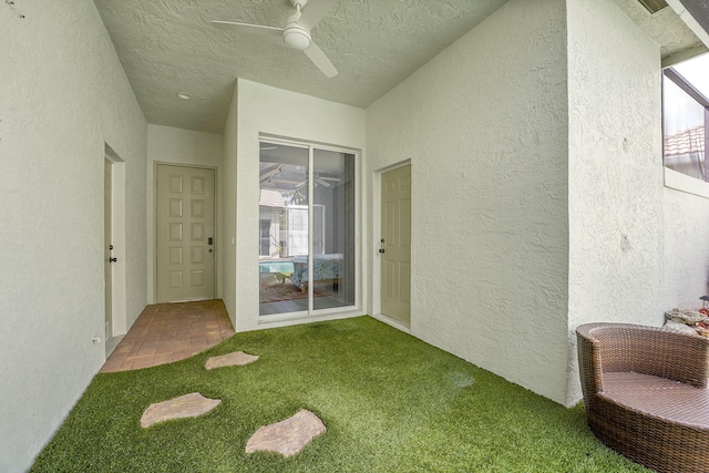 sunroom with a ceiling fan