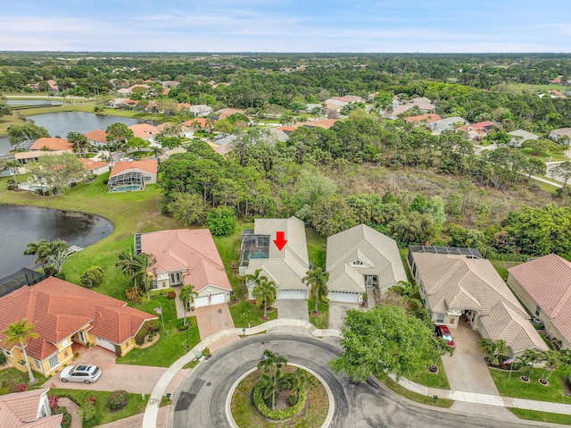 bird's eye view featuring a water view and a residential view