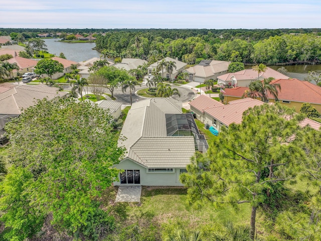 bird's eye view featuring a water view, a residential view, and a view of trees