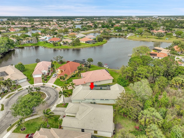 bird's eye view with a water view and a residential view