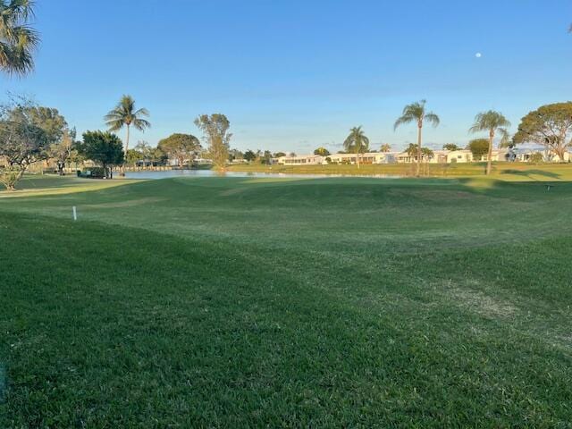 surrounding community featuring a yard