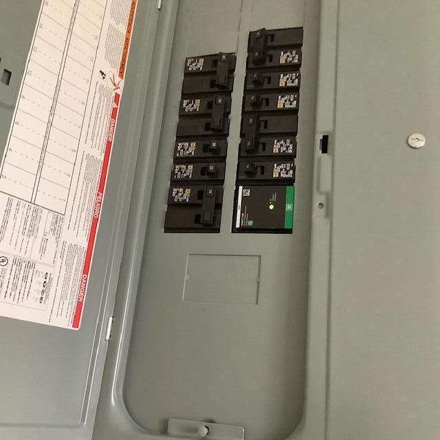 utility room featuring electric panel