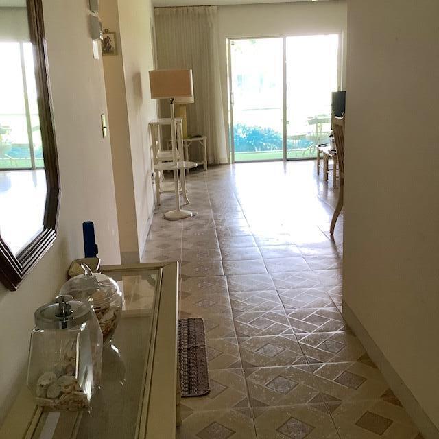corridor featuring baseboards