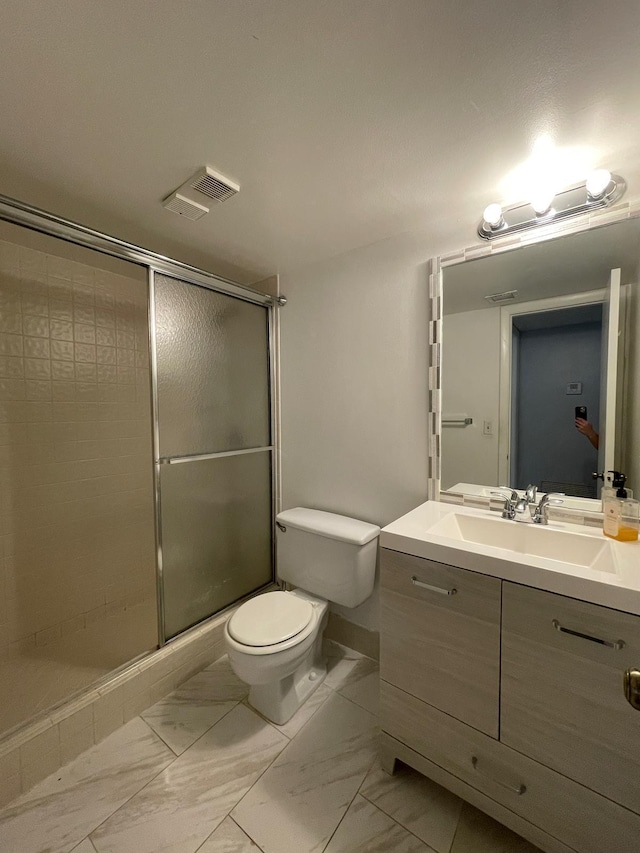 bathroom with visible vents, toilet, marble finish floor, and a shower stall