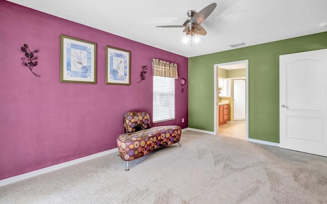 living area with a ceiling fan, carpet, visible vents, and baseboards