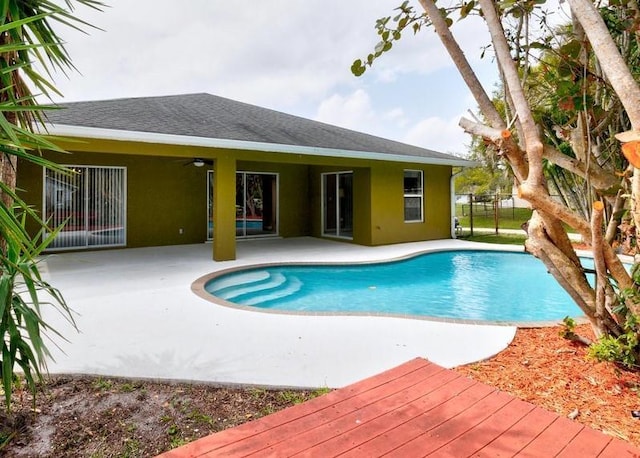 view of pool with a fenced in pool, a patio area, ceiling fan, and fence