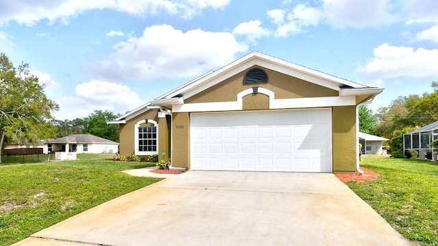 ranch-style house with driveway, an attached garage, a front lawn, and stucco siding
