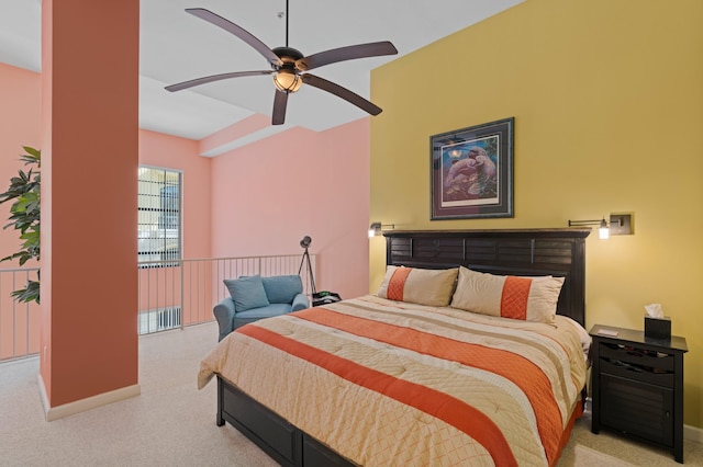 carpeted bedroom with baseboards and a ceiling fan