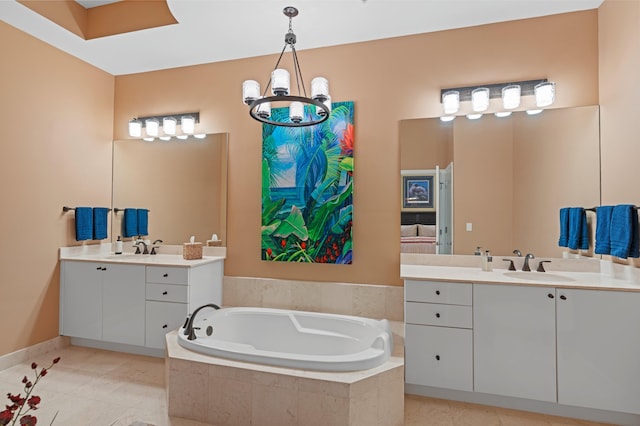 full bath with a garden tub, a sink, two vanities, and tile patterned floors