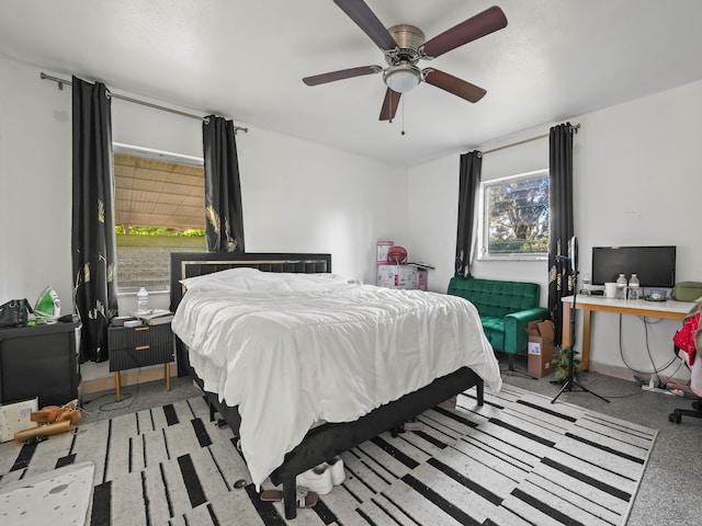 bedroom featuring ceiling fan and baseboards