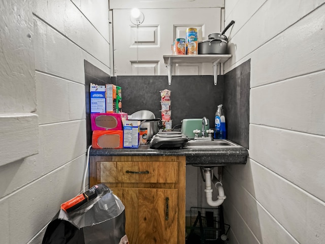 bathroom with concrete block wall