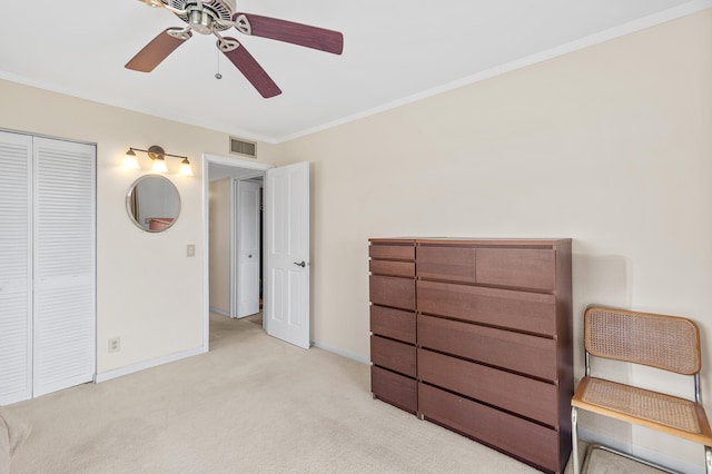 unfurnished bedroom featuring crown molding, carpet, baseboards, and visible vents