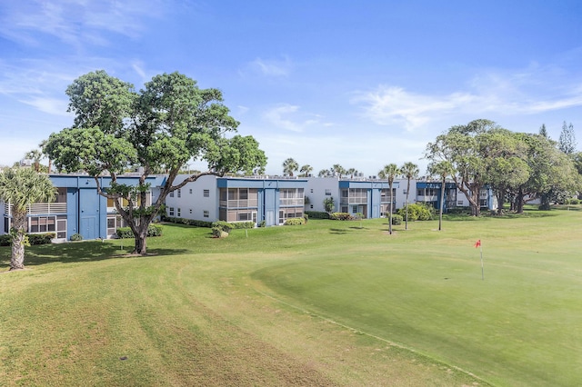 view of property's community featuring a yard