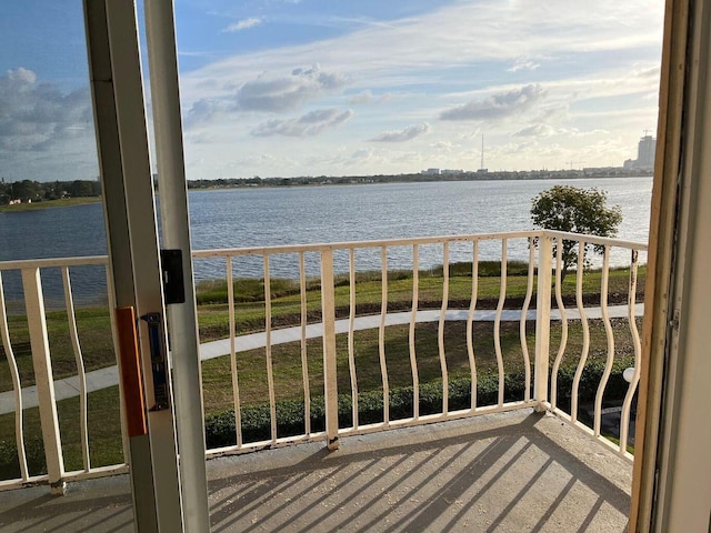 balcony featuring a water view