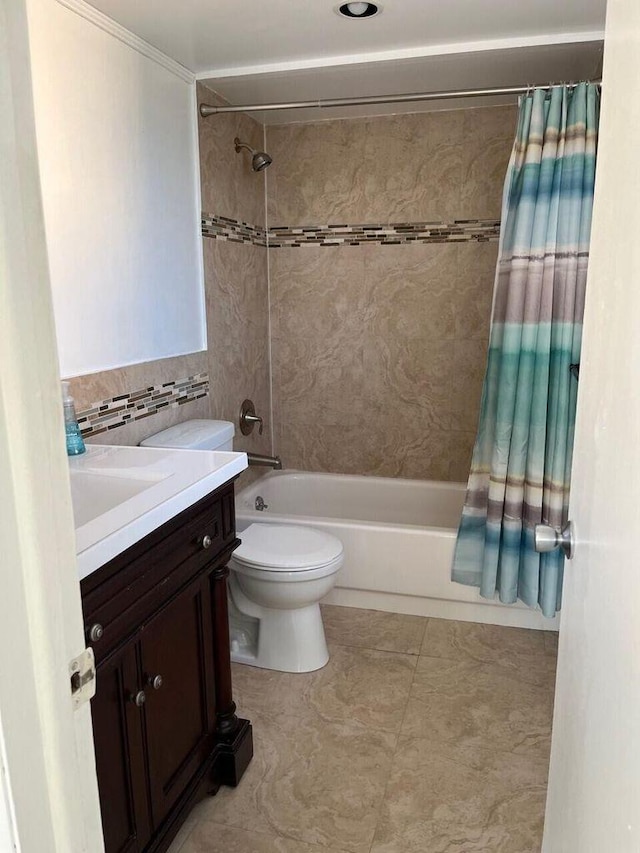 full bath with tile walls, shower / bathtub combination with curtain, toilet, vanity, and tile patterned floors