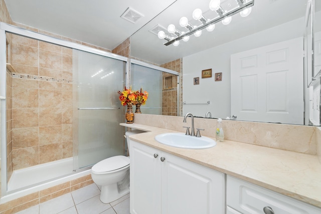 bathroom with toilet, tile patterned flooring, visible vents, and a shower stall