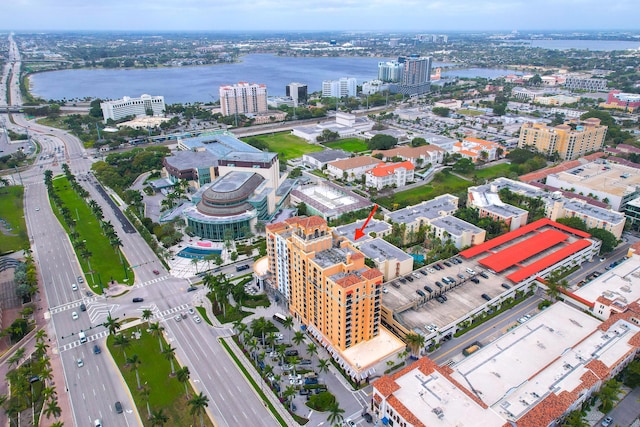 birds eye view of property with a view of city and a water view