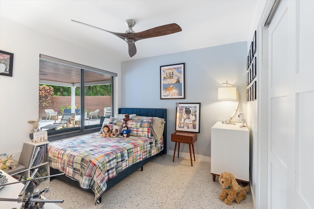 bedroom with ceiling fan, speckled floor, and baseboards