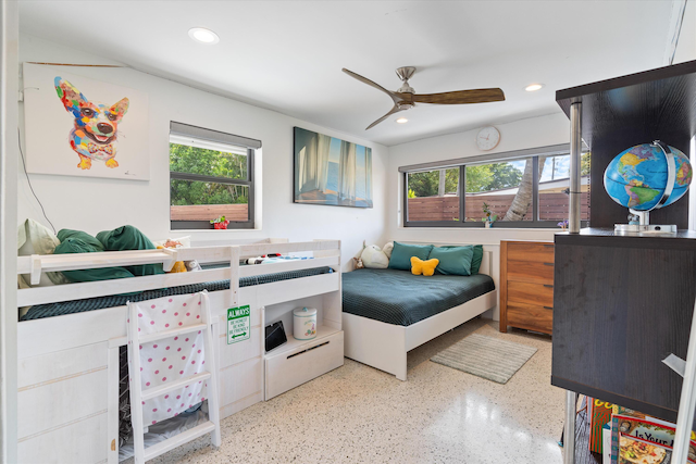 bedroom featuring multiple windows, speckled floor, and recessed lighting