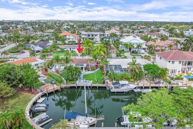 bird's eye view with a residential view and a water view