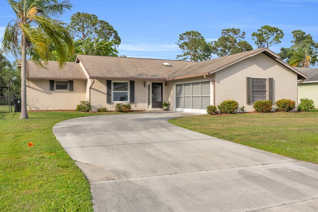 ranch-style house with an attached garage, driveway, a front lawn, and stucco siding