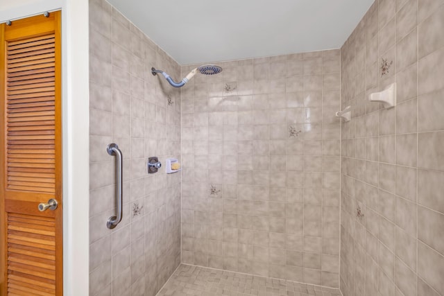 bathroom with a tile shower