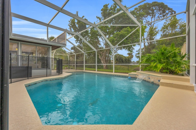 pool with a patio area and a lanai