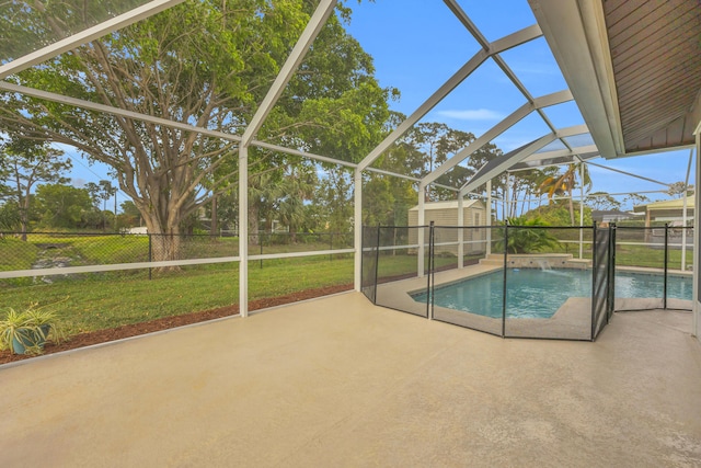 view of pool featuring a storage shed, glass enclosure, a fenced backyard, an outdoor structure, and a patio area