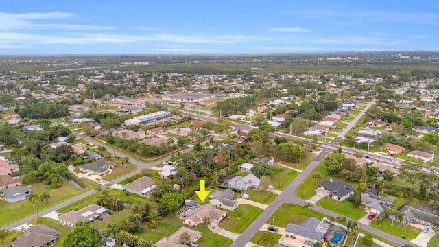 birds eye view of property with a residential view