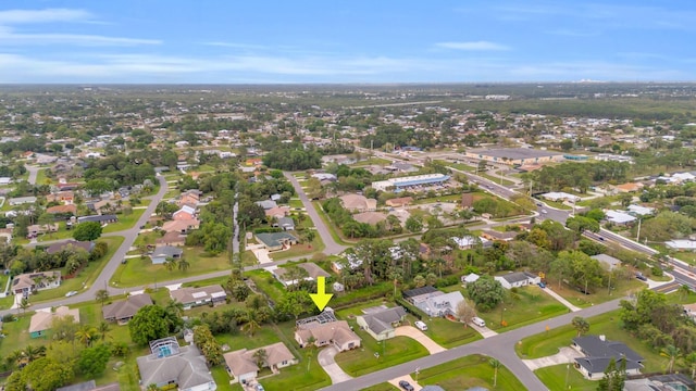 birds eye view of property with a residential view