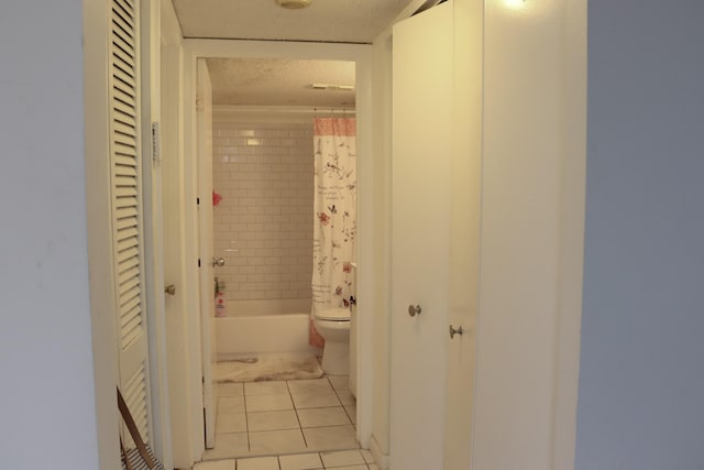 hallway featuring light tile patterned flooring