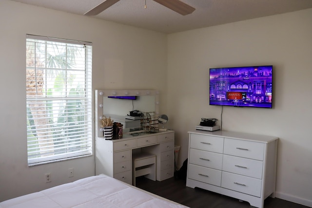 bedroom with dark wood finished floors and a ceiling fan