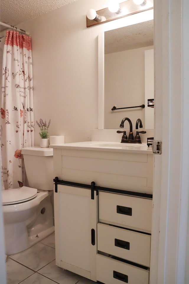 full bath with tile patterned floors, toilet, curtained shower, a textured ceiling, and vanity