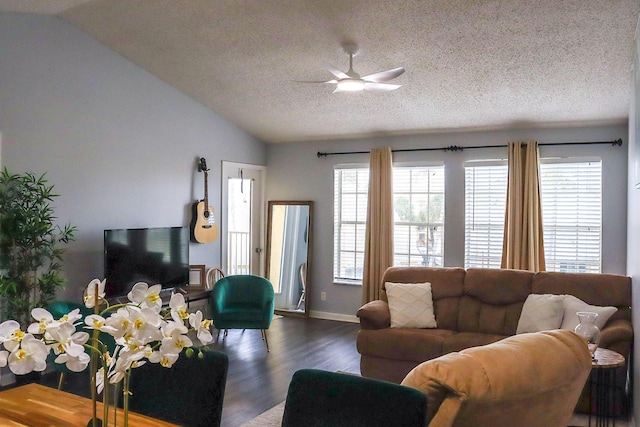 living room with baseboards, ceiling fan, lofted ceiling, dark wood-style floors, and a textured ceiling