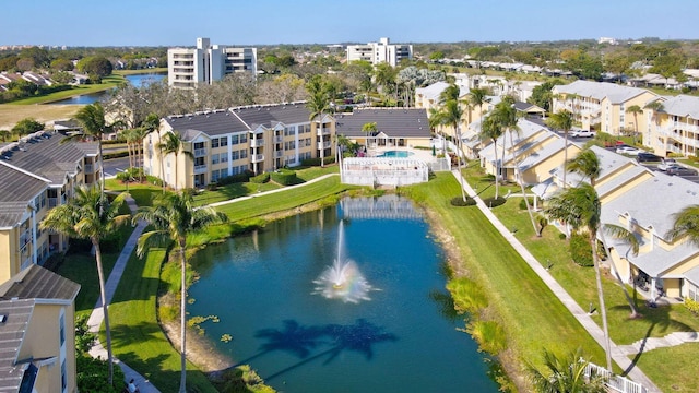 bird's eye view featuring a water view and a residential view