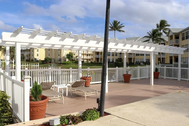 view of patio / terrace featuring a residential view, a pergola, and fence