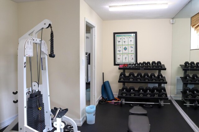 exercise room with baseboards