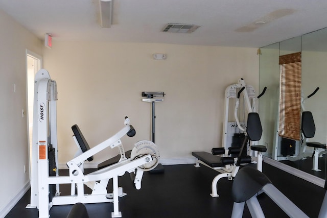 workout area with baseboards and visible vents