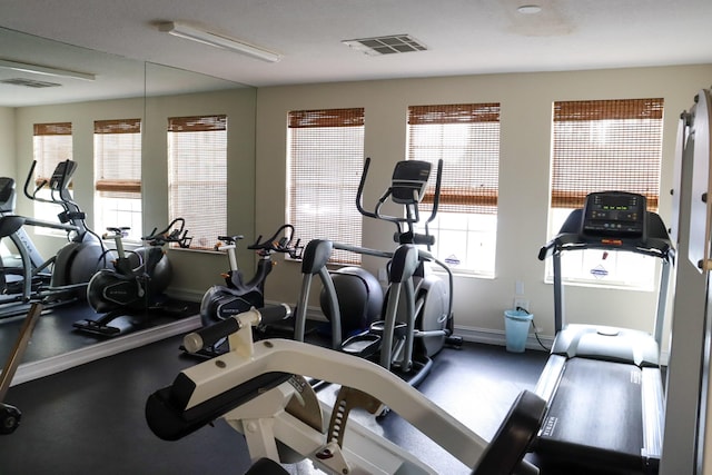 gym featuring visible vents and baseboards