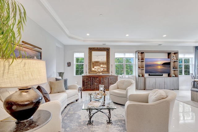 tiled living area featuring crown molding, a tray ceiling, plenty of natural light, and recessed lighting