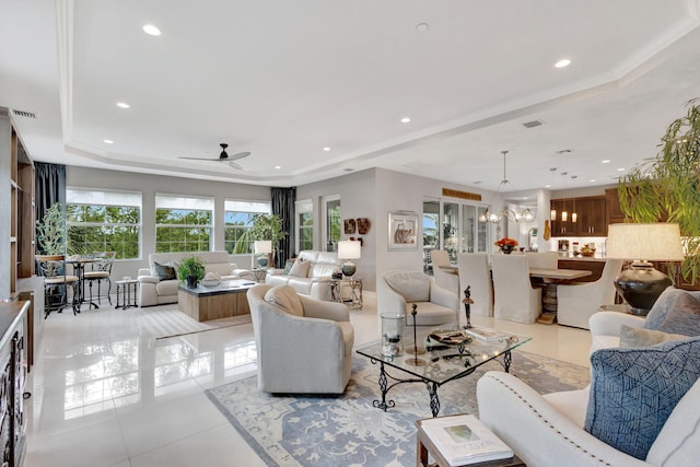 living area featuring light tile patterned flooring, a raised ceiling, visible vents, and recessed lighting