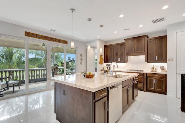 kitchen with recessed lighting, stainless steel appliances, a sink, visible vents, and backsplash