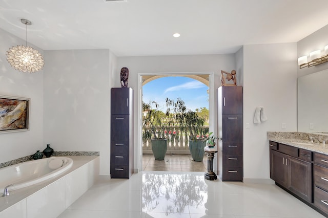 full bath with tile patterned flooring, visible vents, a garden tub, and vanity