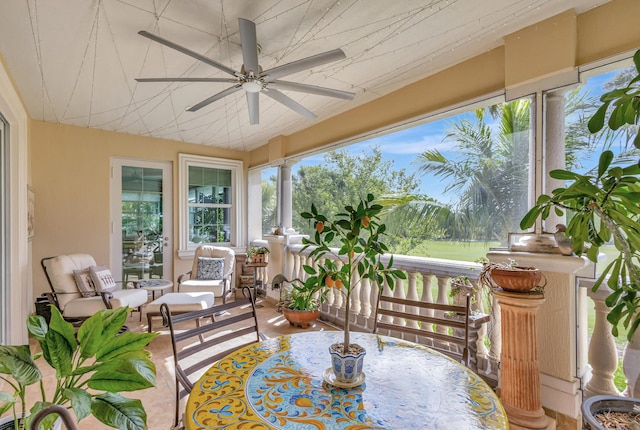 sunroom / solarium featuring ceiling fan