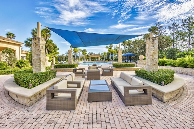 view of patio / terrace with a community pool and an outdoor hangout area